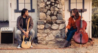 The Nextdoors, Russell and Mika, with guitars